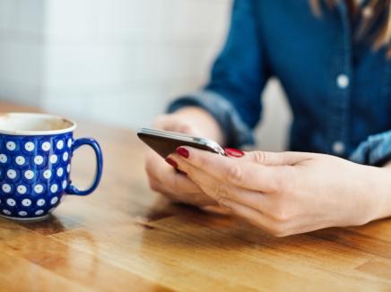 A person viewing their mobile phone.