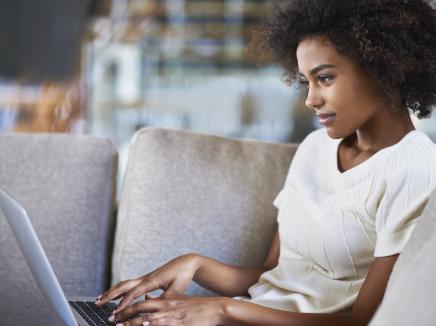 woman sitting at her laptop from home