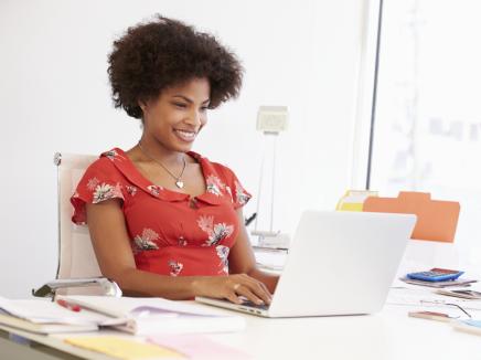 Woman reading laptop