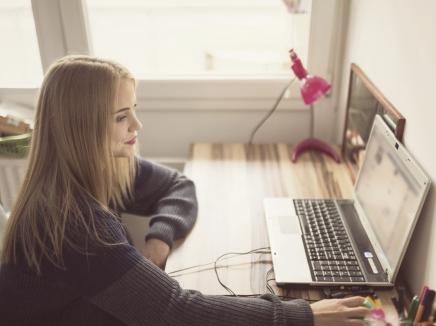 woman checking her computer