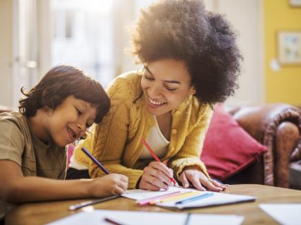 A mother helping her child with homework.