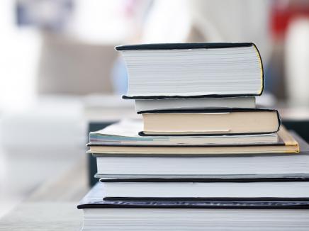 A stack of books on a table.