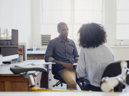 Two coworkers talking 