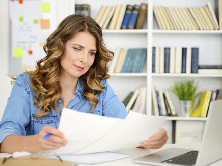 A woman working at her desk.