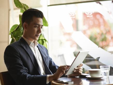 A man using a tablet. 