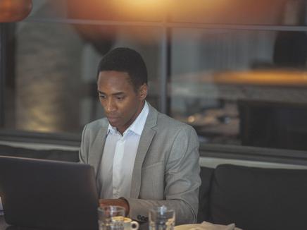 A man using his laptop computer.
