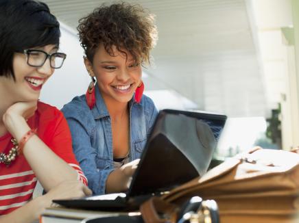 Two women looking at a computer
