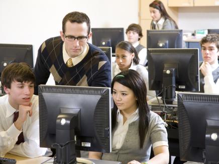 teacher and students in a computer lab